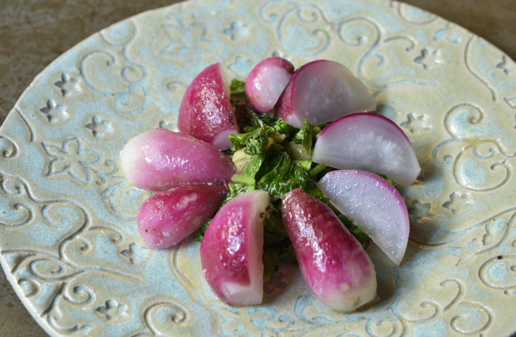 Braised radishes on a bed of sauteed radish greens